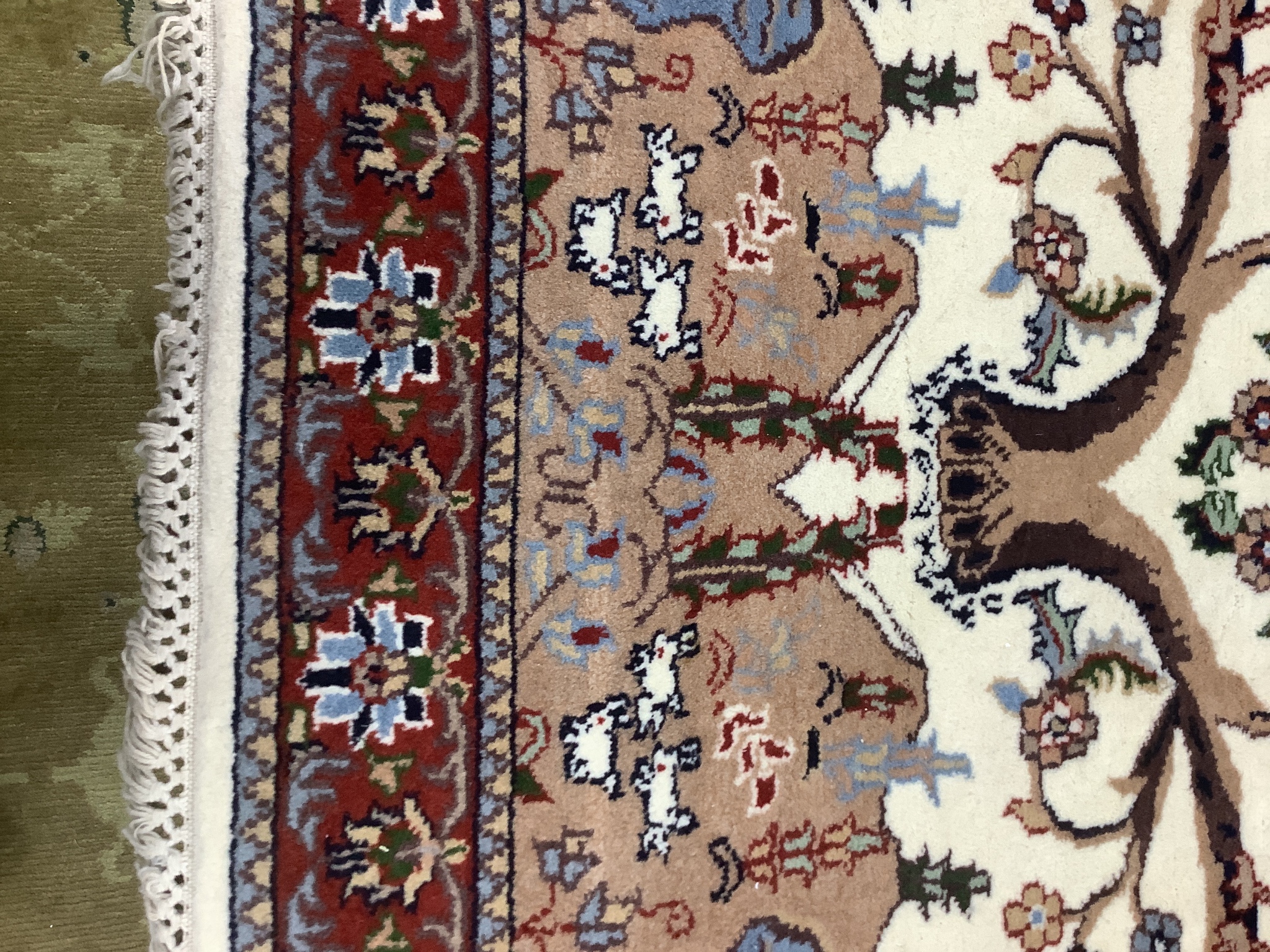 A Tabriz ivory ground 'Peacock' rug, 122 x 120cm